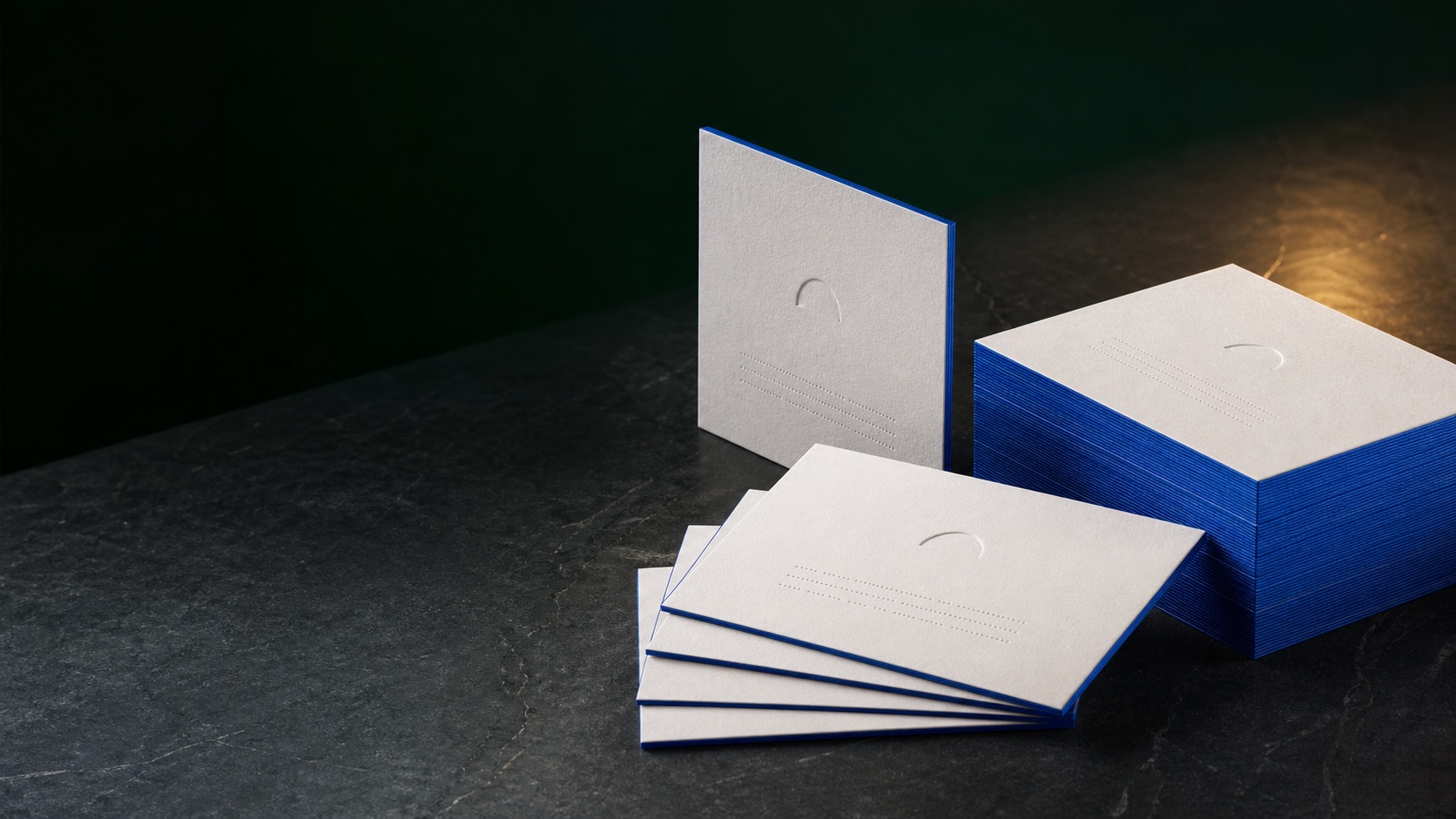 Commercial Digital Cards arranged in a dark green editorial studio
